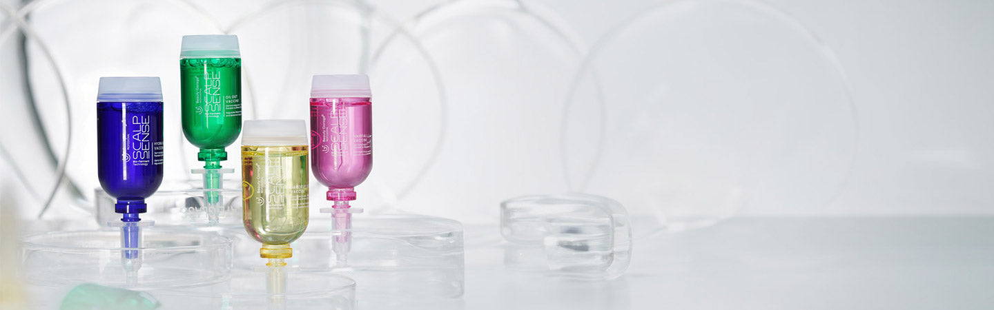 Shea Scalpsense Vaccine standing on clear bases incorporating the innovative Hair Scalpsense formula for nourished hair.